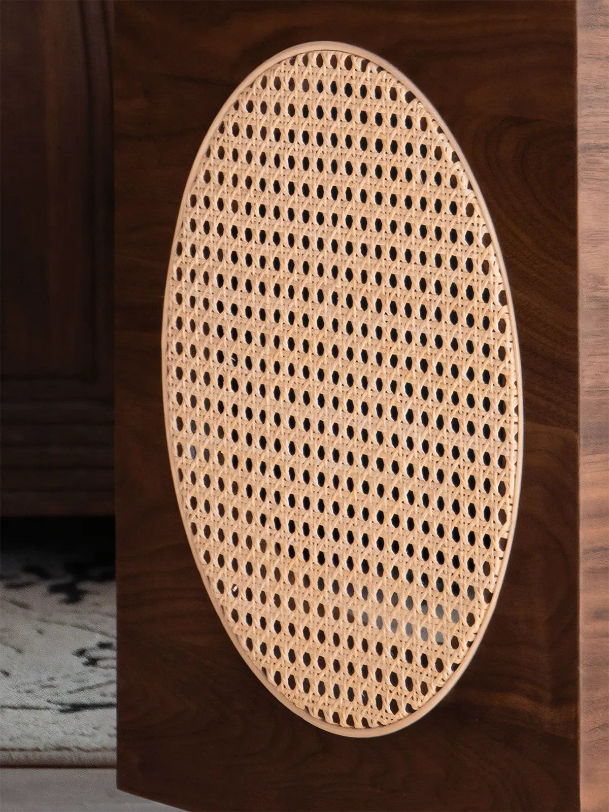 Detail shot of breathable natural rattan cane webbing on the side of the Sylvan cat litter enclosure