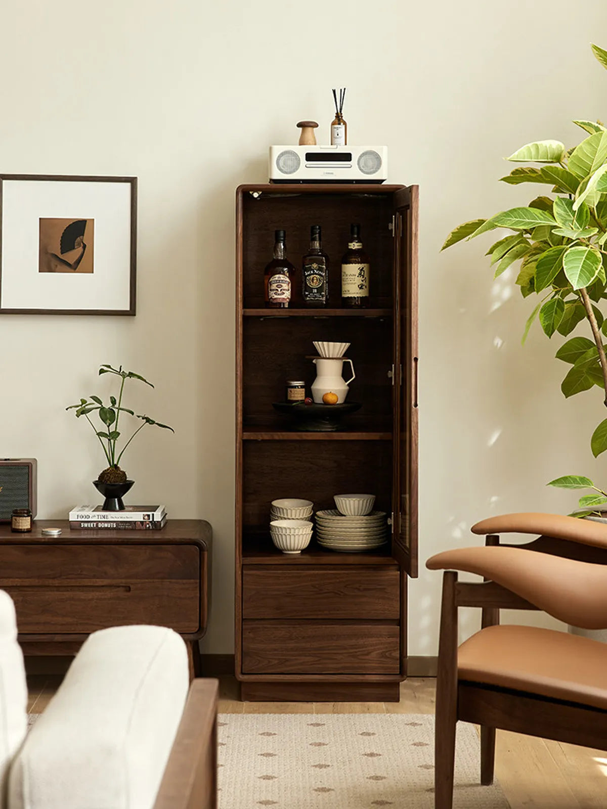 Kurumi solid walnut cabinet with door open showing ample vertical storage space.

