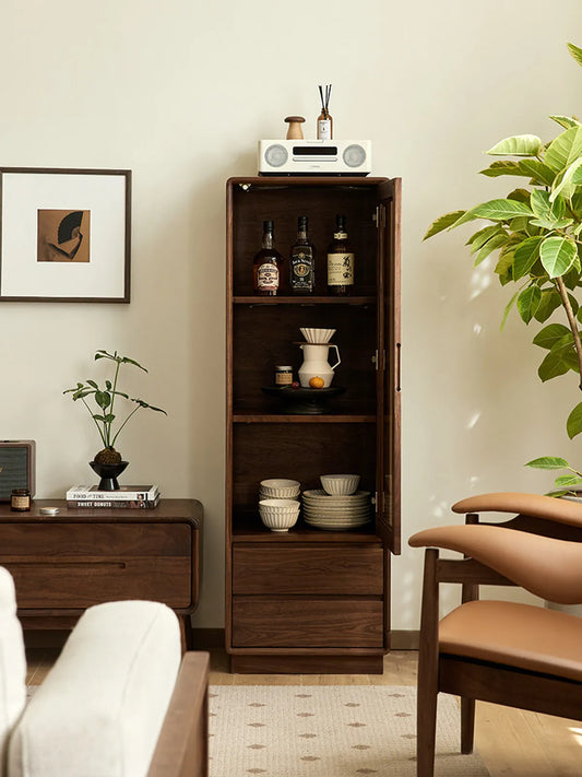 Kurumi solid walnut cabinet with door open showing ample vertical storage space.

