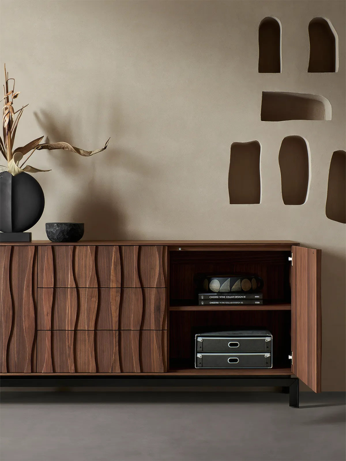 Open cabinet doors of the Walnutry Suiseki sideboard revealing spacious interior storage compartments and adjustable wooden shelves.