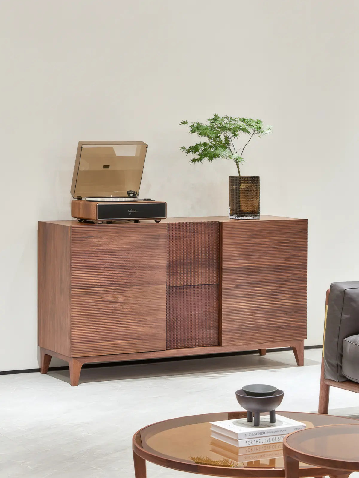 Angled view of The Opus record player stand, highlighting the rich grain of North American black walnut and the tapered leg design.