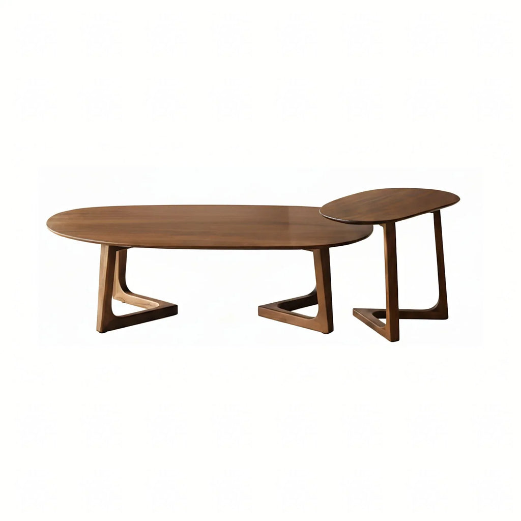 Set of two Walnutry Pebble solid walnut nesting coffee tables with organic irregular shapes.