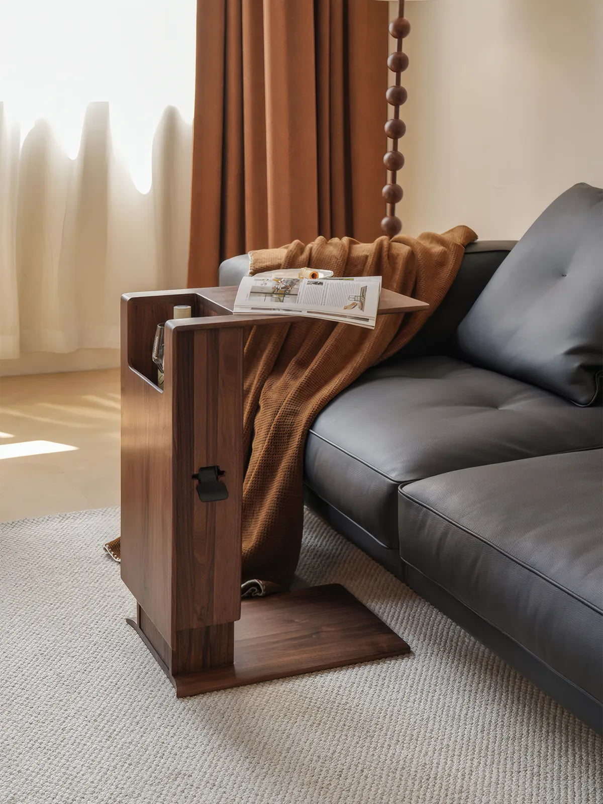 Side profile of pneumatic adjustable end table showing black lever and slide-under base.