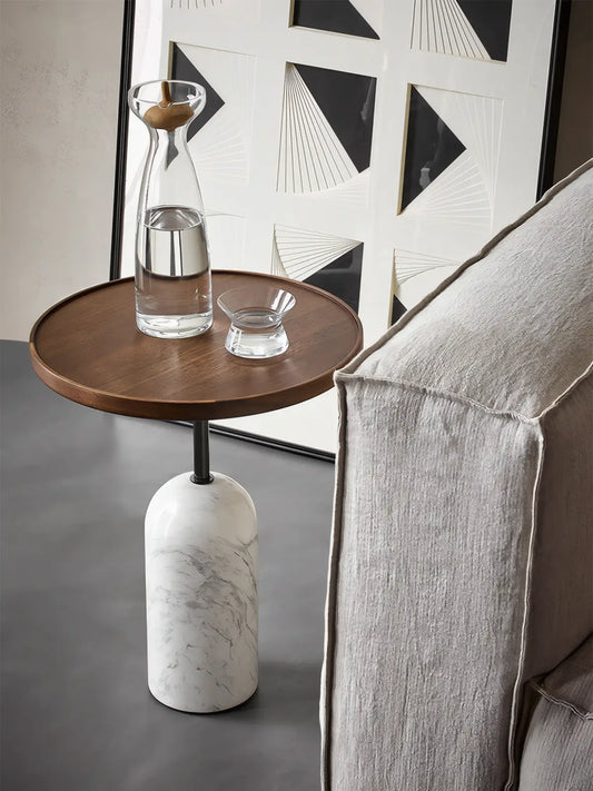 Top-down view of round walnut end table showing rich heartwood colors and satin oil finish.