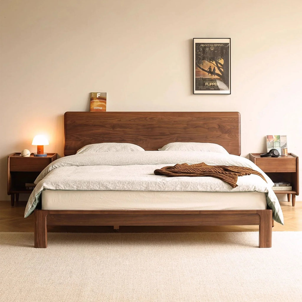 Modern small apartment bedroom idea featuring a space-saving walnut bed frame.