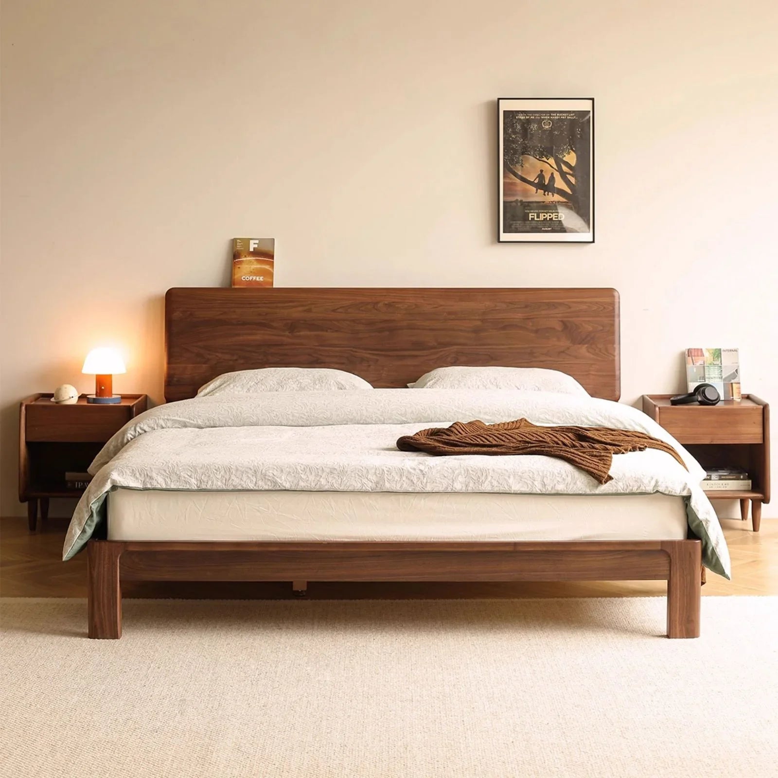 Modern small apartment bedroom idea featuring a space-saving walnut bed frame.