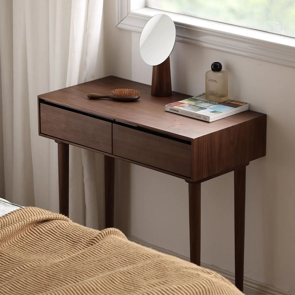 Modern minimalist bedroom featuring a compact solid wood dressing table that doubles as a nightstand.