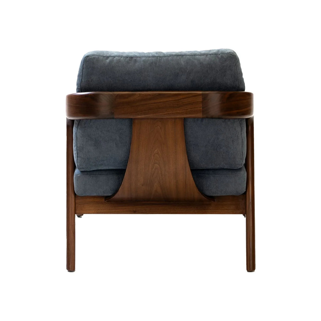 Walnutry solid black walnut lounge chair with dark wood frame and gray cushioned upholstery viewed from the back