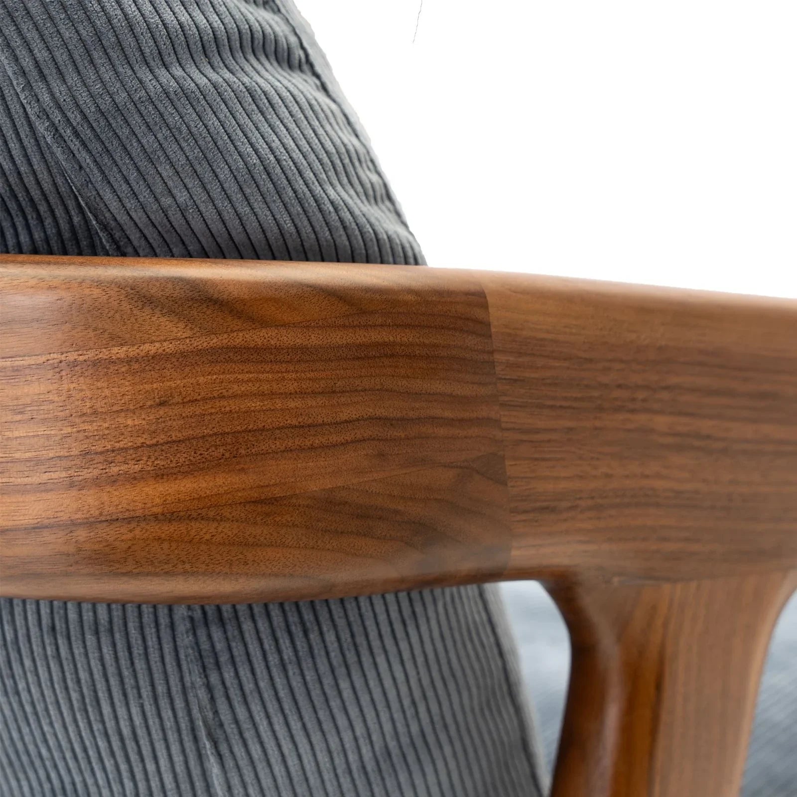 Close-up of solid black walnut lounge chair backrest crafted by Walnutry with smooth wood grain
