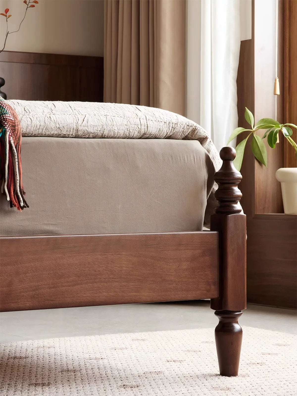 Macro shot of FAS grade North American black walnut wood grain on bed footboard.
