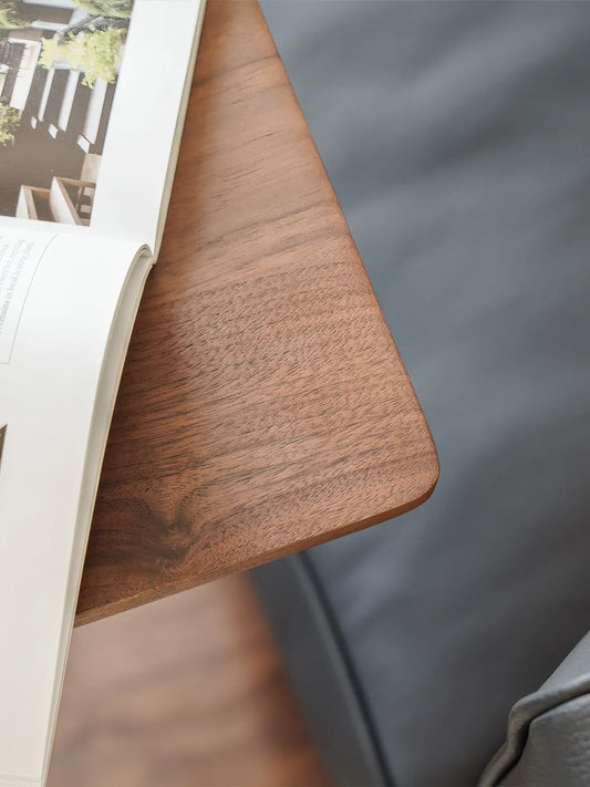 Close-up detail of solid North American Black Walnut wood grain and rounded corners.