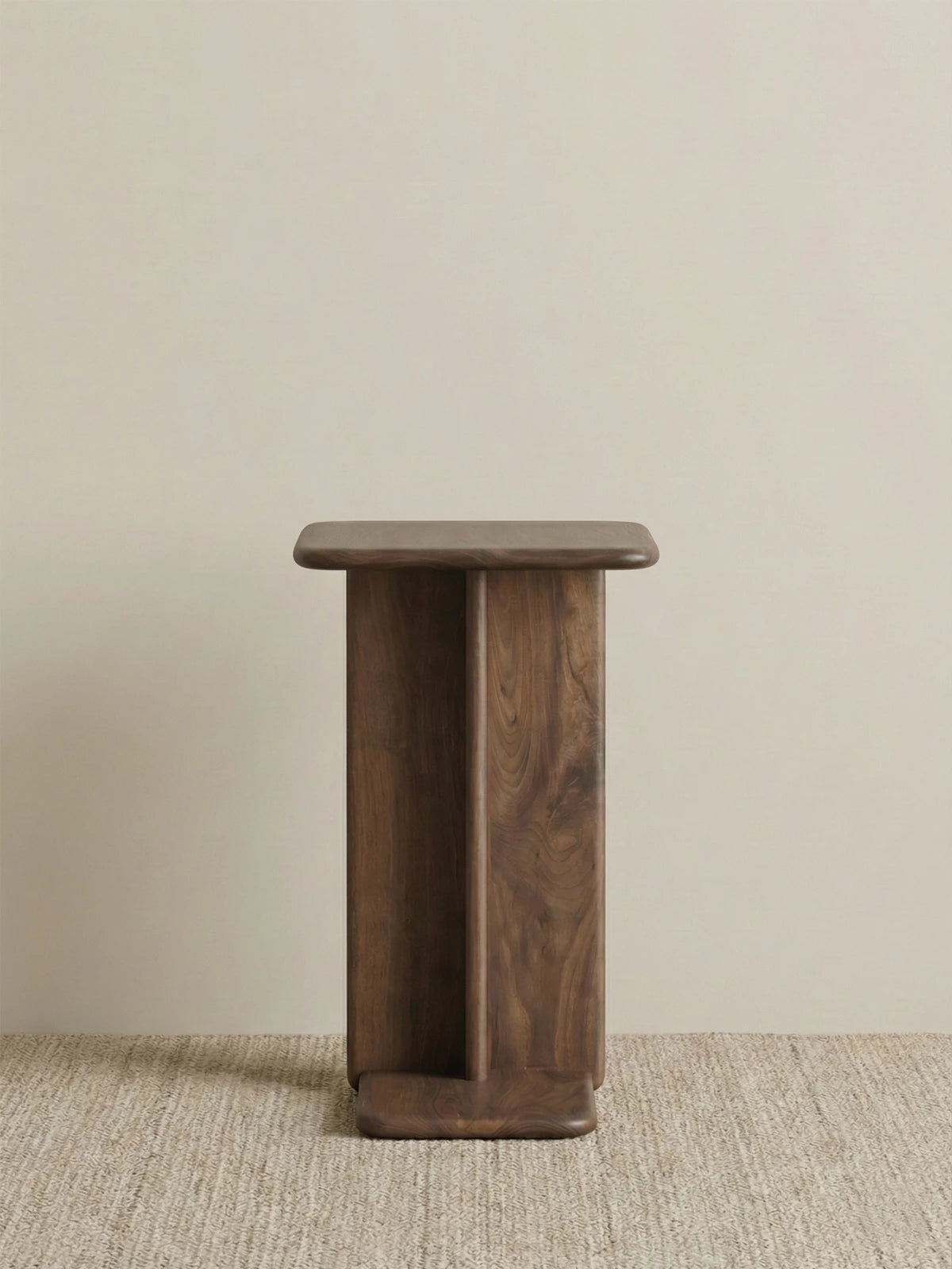 Front view of the Suiseki solid wood C-table isolated on a neutral background, highlighting the sturdy vertical support and natural wood tone.