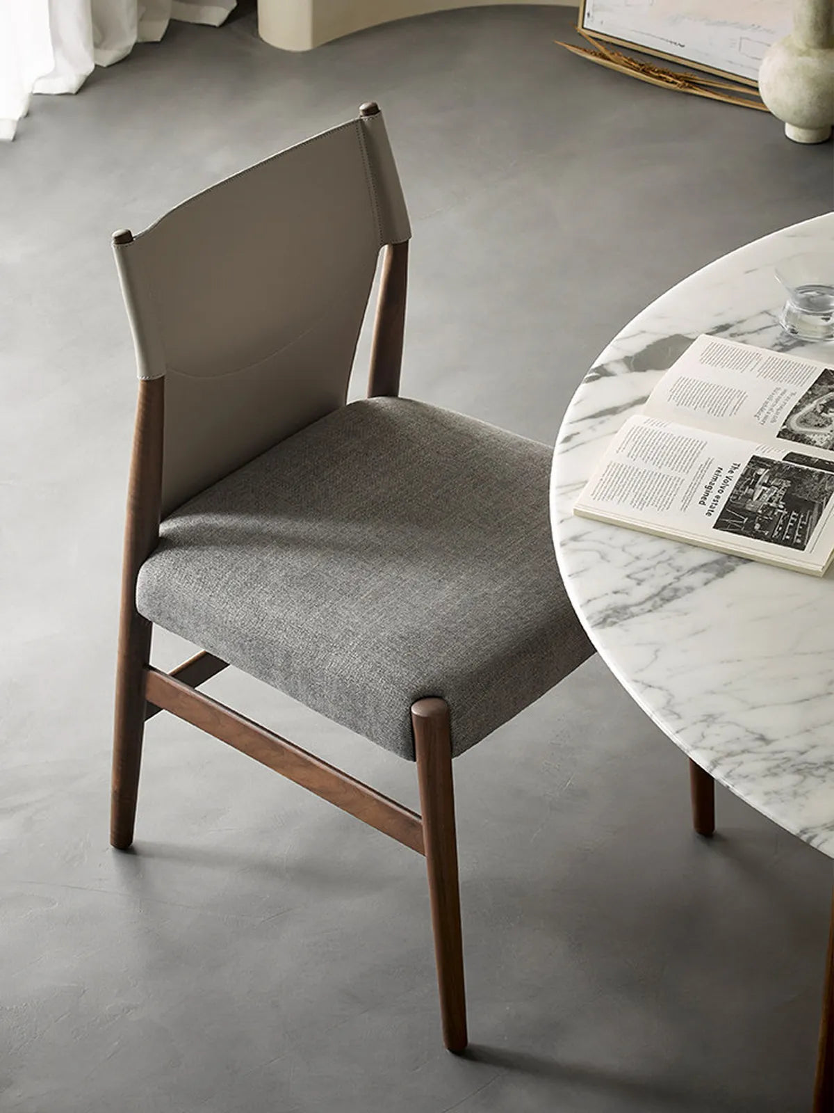 Rear view of the dining chair highlighting the distinctive North American Black Walnut grain patterns and handcrafted joinery details.
