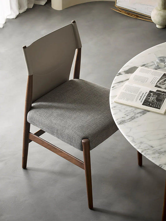 Rear view of the dining chair highlighting the distinctive North American Black Walnut grain patterns and handcrafted joinery details.