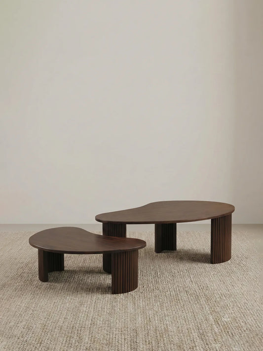 "Studio isolation shot of the Walnutry Kurumi solid wood nesting table set on a neutral background."