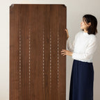 WALNUTRY WOOD solid walnut dining table held by woman showcasing rich wood grain and smooth finish