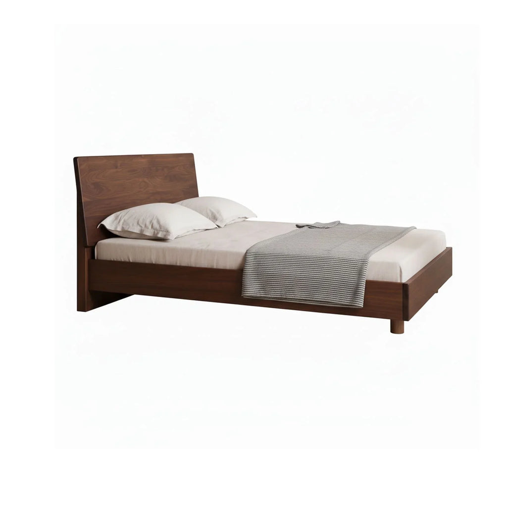 Queen solid walnut floating bed frame with beige bedding and gray striped throw