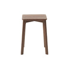 Minimalist solid walnut wood stool with round top and four angled legs