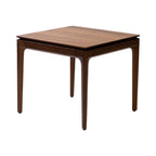 Walnutry solid walnut table with a sleek square top and tapered legs in rich wood finish