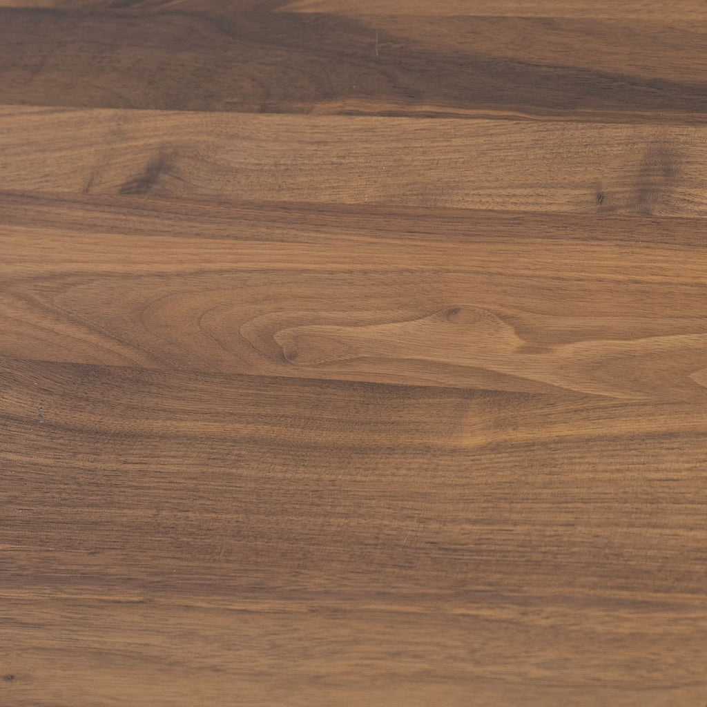 Close-up of Walnutry solid walnut table showing natural wood grain and smooth finish