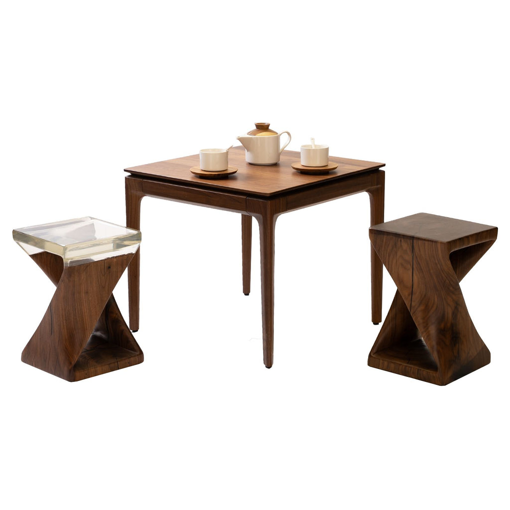 Walnutry solid walnut table with two matching wooden stools and tea set on top