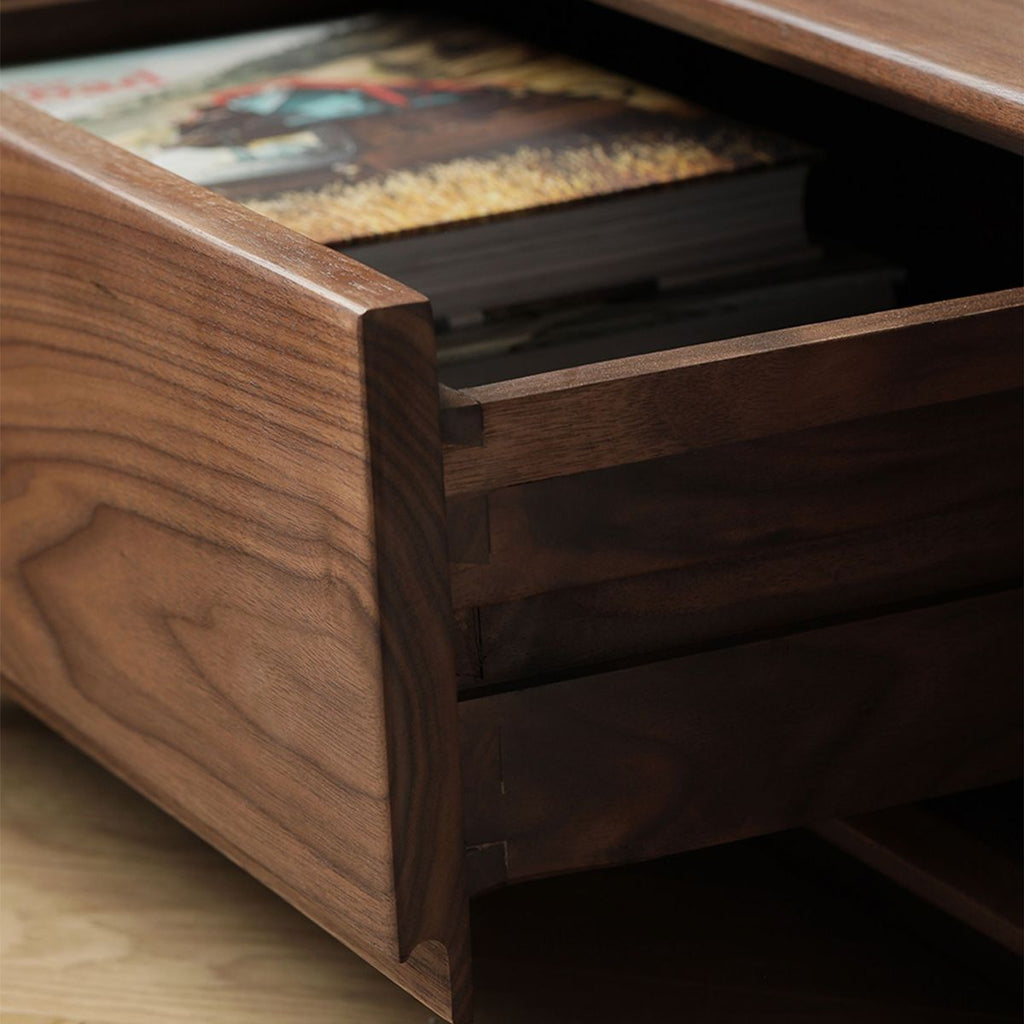 Open drawer of the Lowline TV stand showing 100% solid walnut construction with no auxiliary wood.