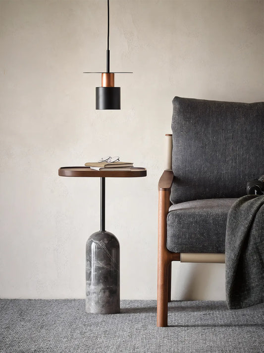 Profile view of the solid wood pedestal base, highlighting the smooth curve and stable footprint.