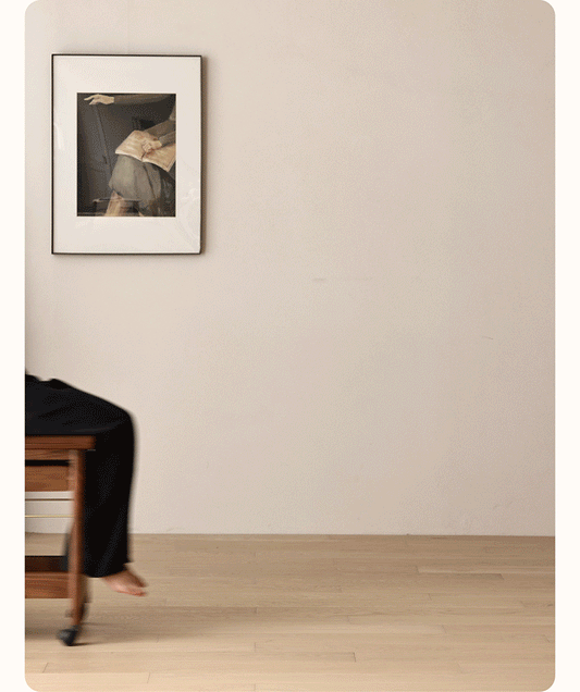 Solid wood rolling cart side table transforming from bench to multiple table configurations in minimalist room