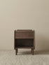 Detail view of solid walnut tapered legs with floor protectors, highlighting structural stability.