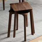 Three solid wood round stools stacked vertically to show space-saving design.