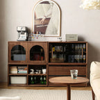 Vertical stacking configuration of walnut storage modules used as a room divider and bookcase.