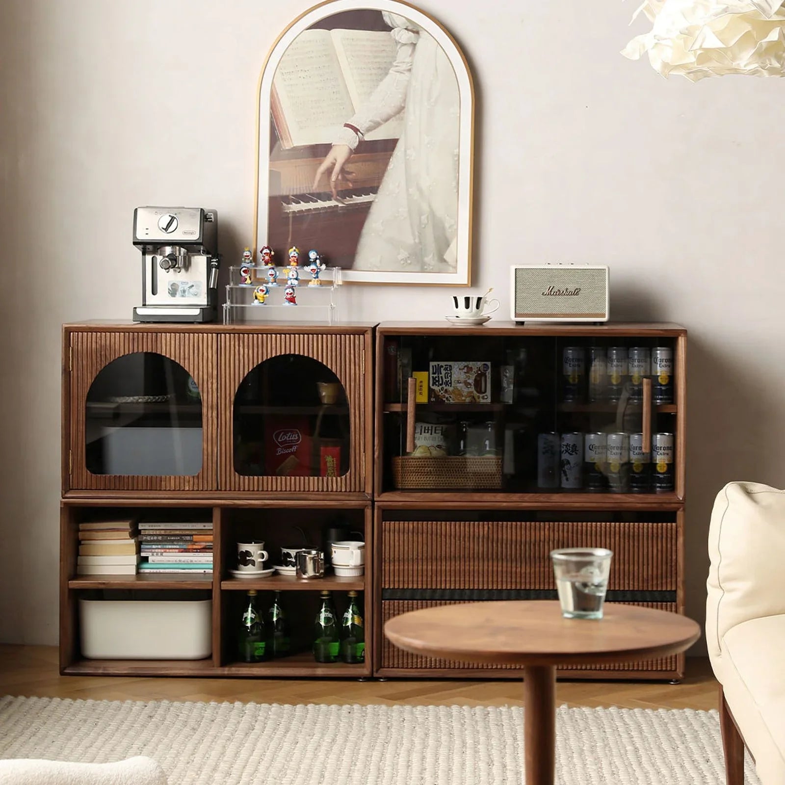Vertical stacking configuration of walnut storage modules used as a room divider and bookcase.