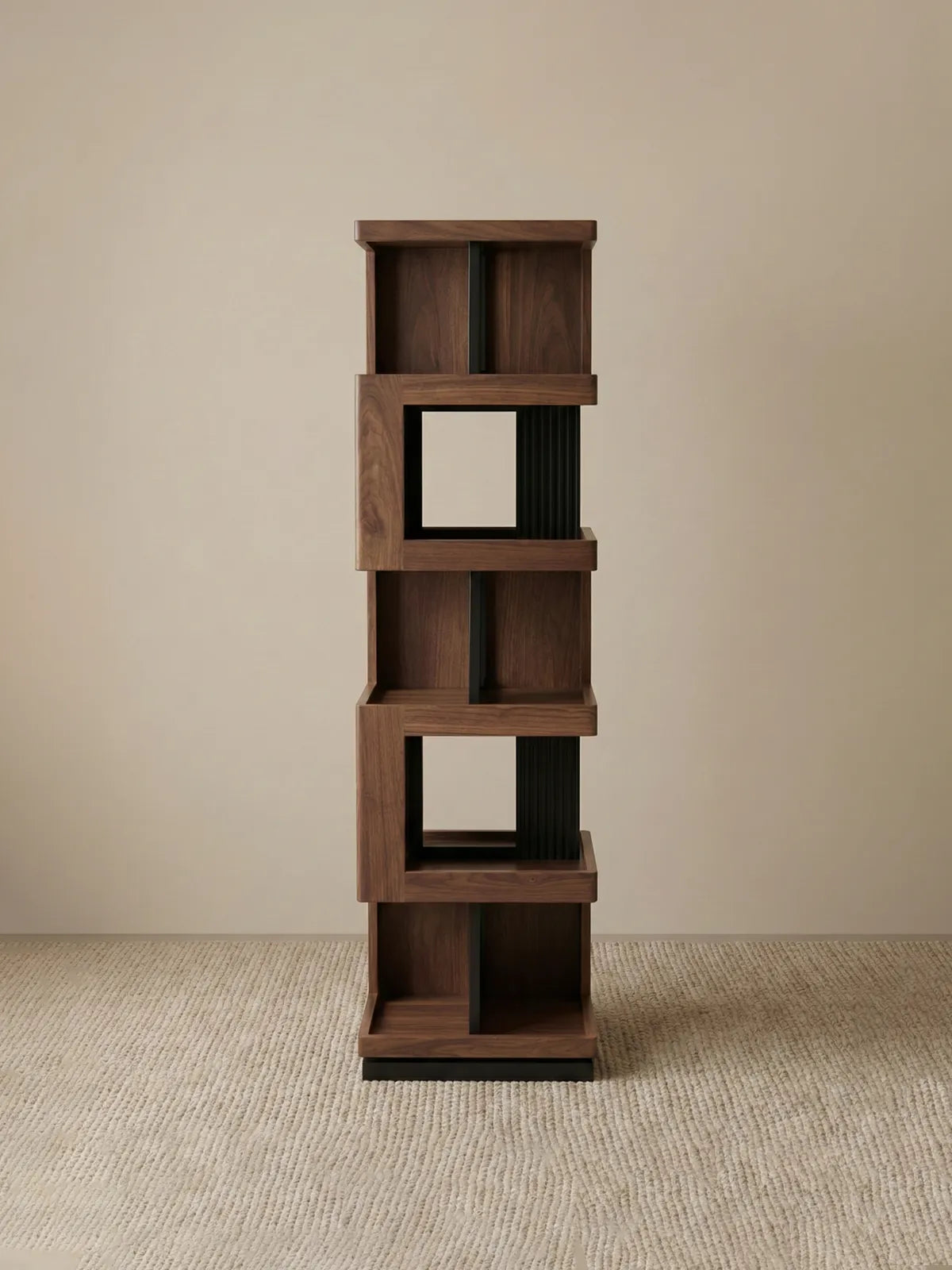 Studio shot of the empty Walnutry Suiseki rotating bookshelf showing the sculptural form and solid wood construction.