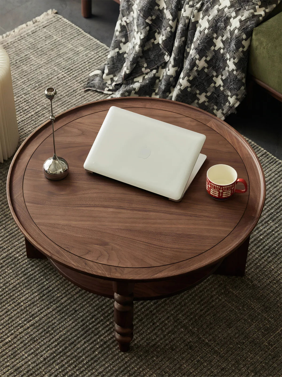 Top-down view of 31.5 inch round walnut table surface with laptop and coffee cup, showing ample workspace.