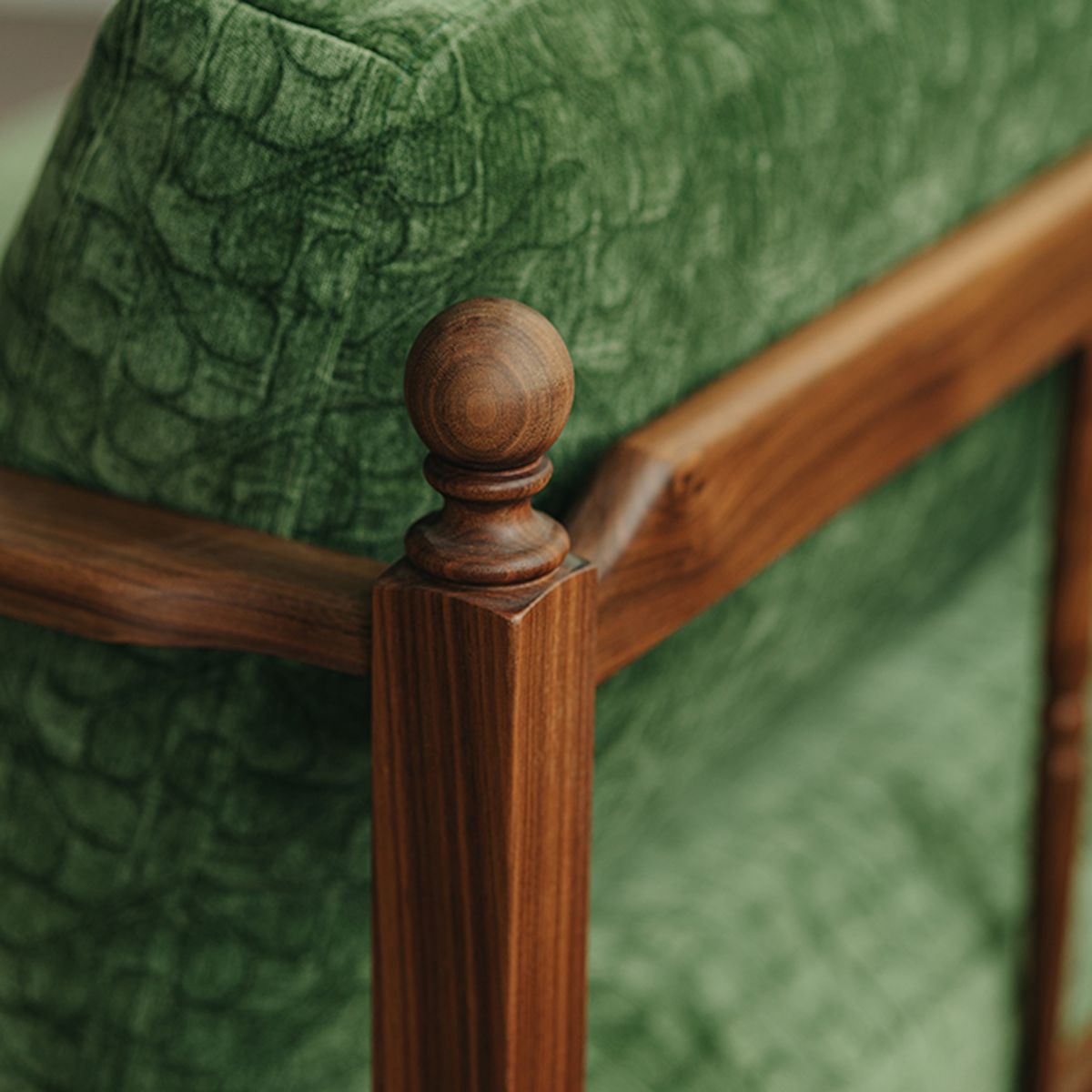 Close-up detail of the hand-turned wooden roman column spindles on the walnut sofa armrest.