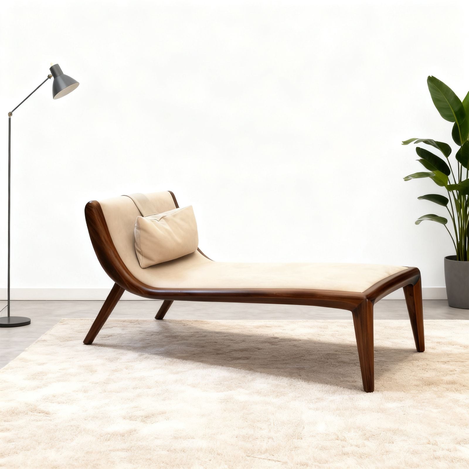 Walnut sculptural chaise lounge with beige cushion and pillow, set on cream rug near floor lamp and potted plant