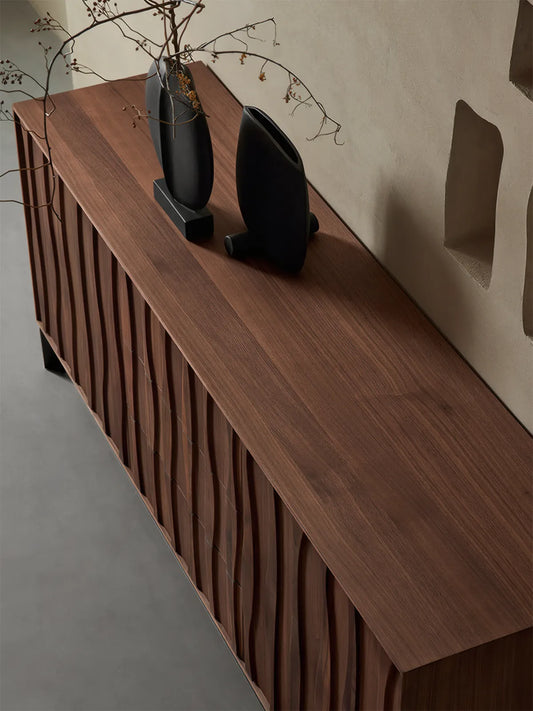 High-angle view of the Suiseki sideboard top surface, showcasing the premium North American Black Walnut heartwood grain patterns and depth.