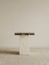 Walnutry Cumberland side table with solid walnut frame and honed travertine base in a minimal studio setting.
