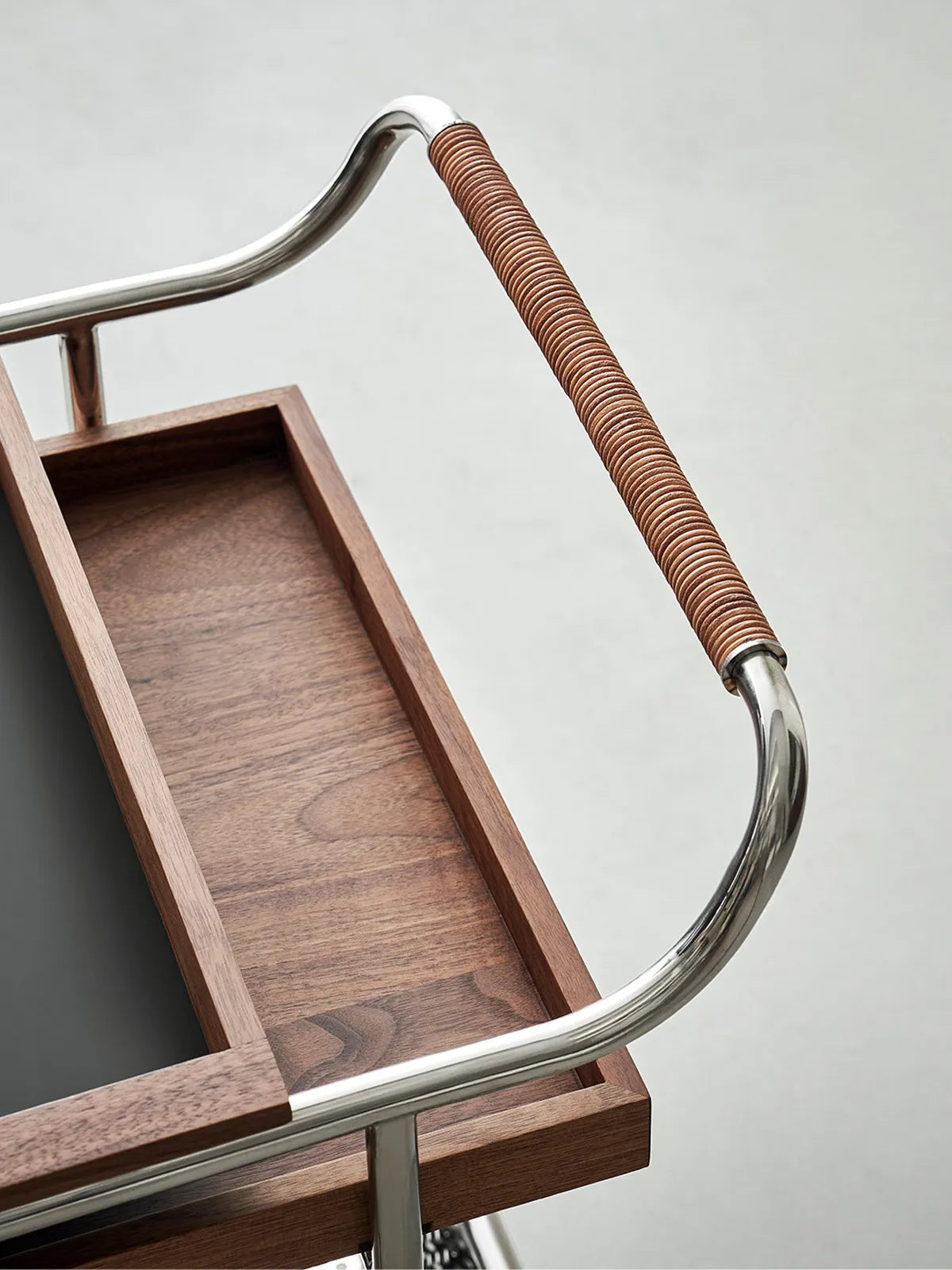Top-down view of the solid North American Black Walnut wood grain texture on the bar cart tray.