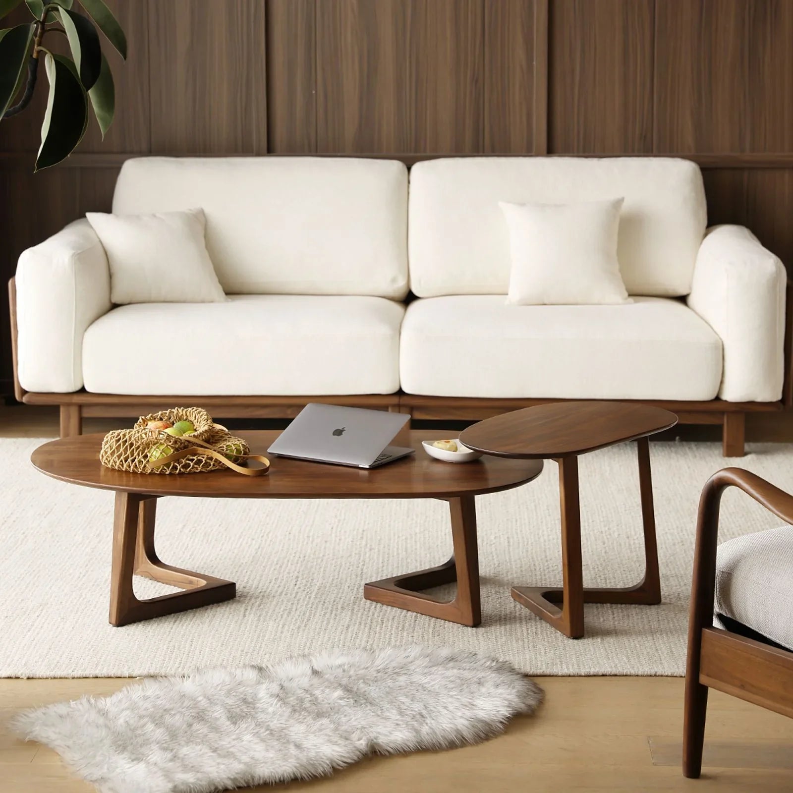 Top view of the pebble-shaped table top showing the rich grain of solid North American walnut.