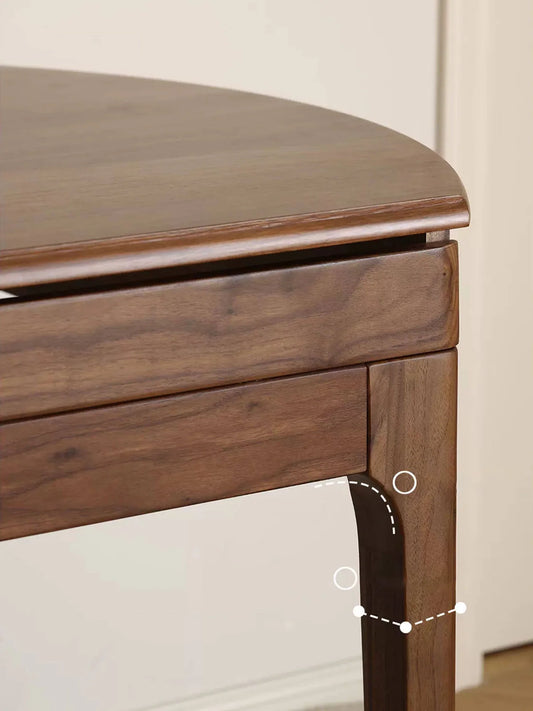 Detail view of the table corner and leg joinery, highlighting the rounded edge, apron, and smooth wood connections.