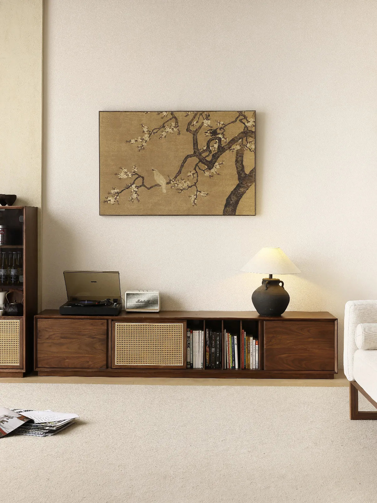 Walnutry Arden walnut entertainment center styled with turntable, speaker, and lamp