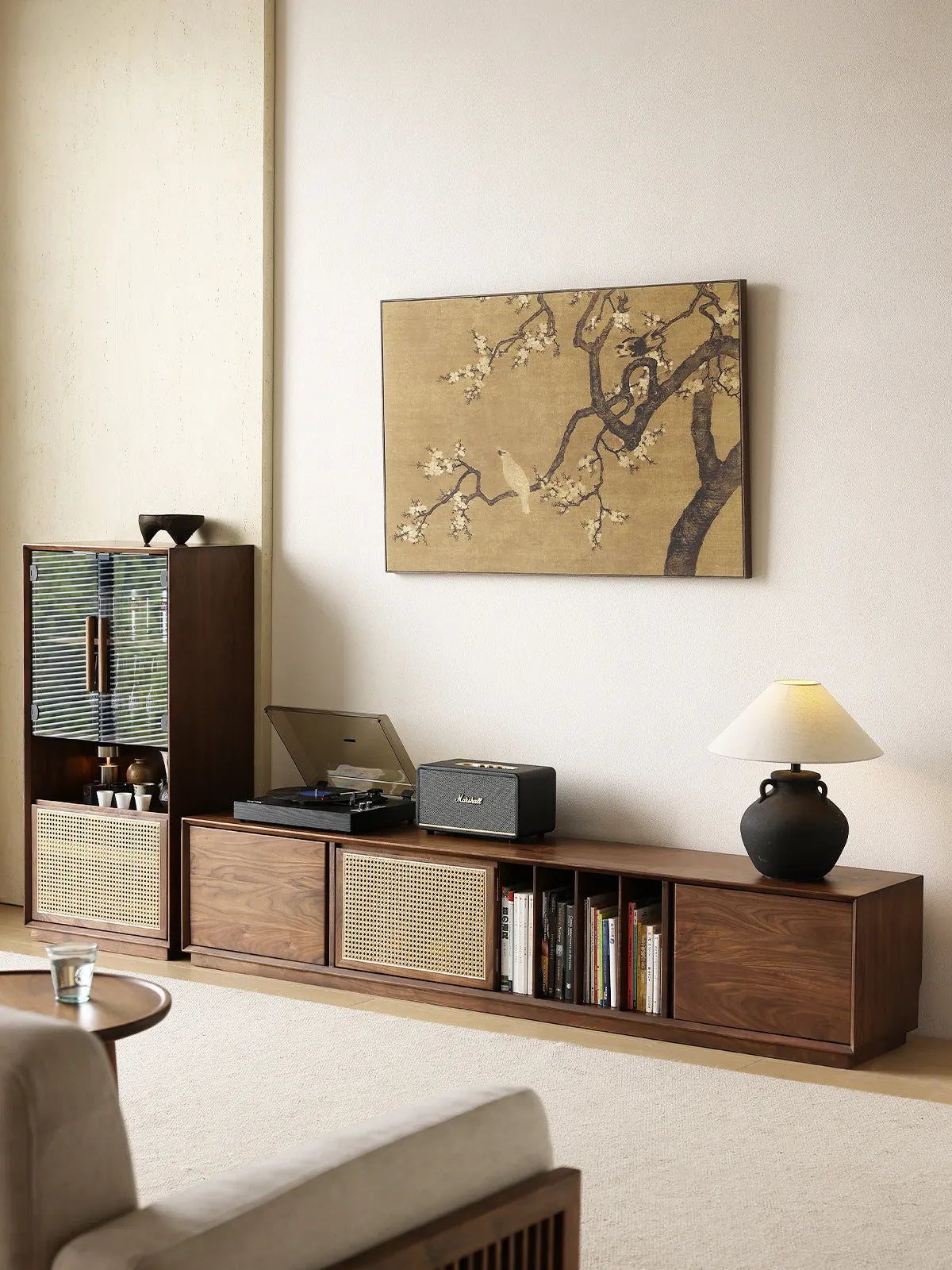 Walnutry Arden walnut entertainment center styled in a warm living room