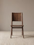 Front view of the Arlen Dining Chair in solid walnut, showing the horizontal backrest cutout and contoured seat.