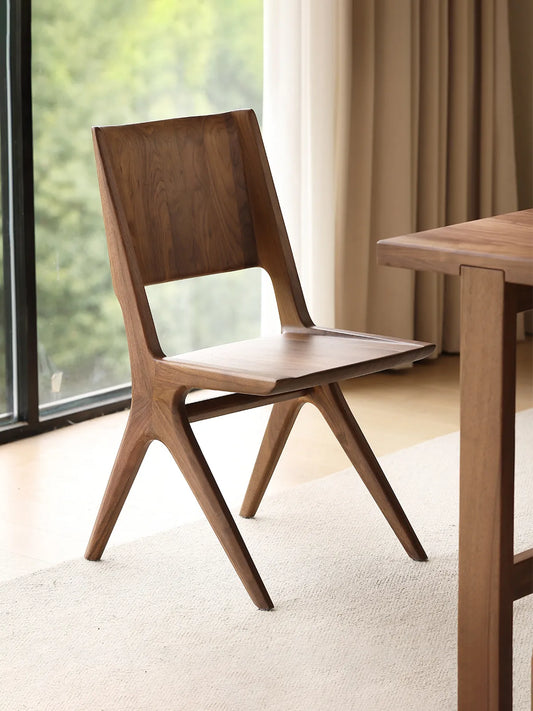 Three-quarter view of the Arlen Dining Chair showing overall silhouette and seat contour.
