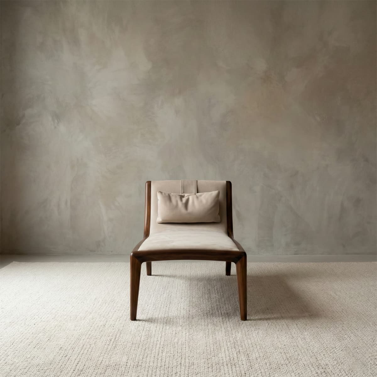 Contemporary armless accent chair with cream upholstery and a lumbar pillow, supported by a sleek solid walnut wood structure.