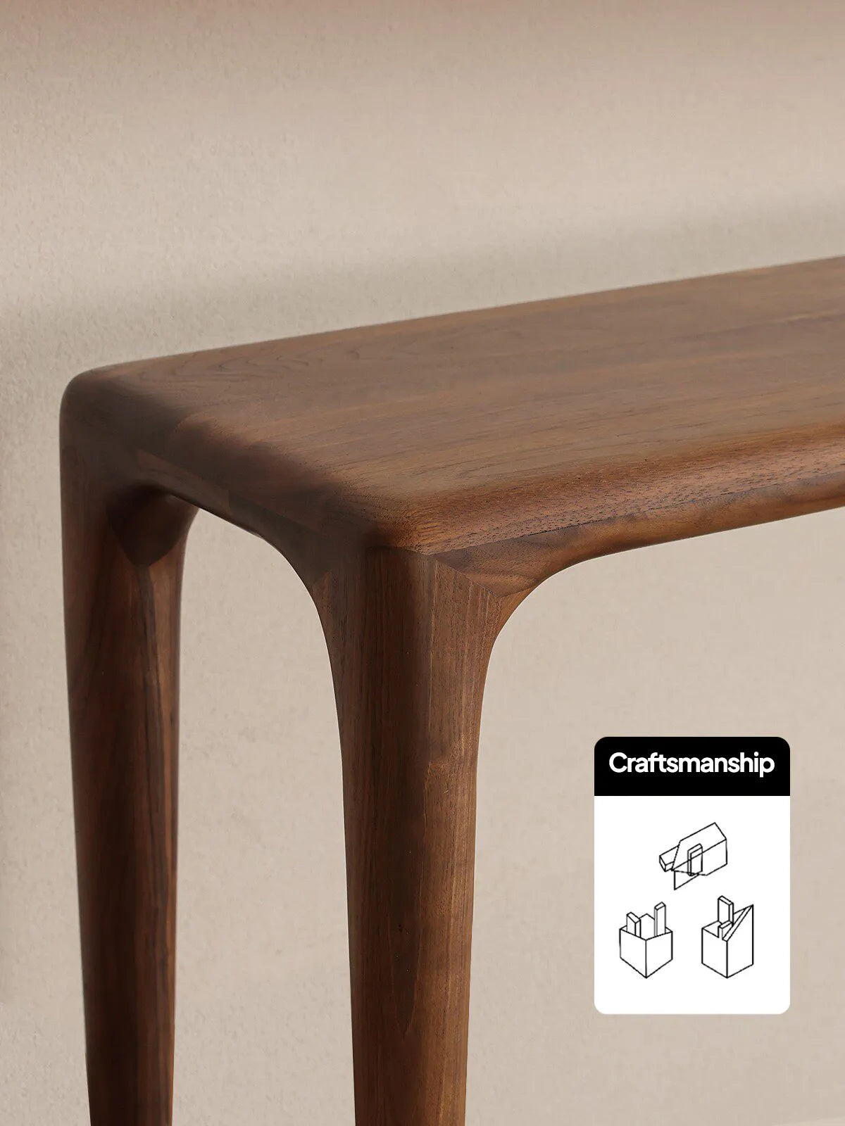 Close-up of the Auren Walnut Bench showing rounded waterfall edges, smooth solid walnut grain, and refined joinery craftsmanship.