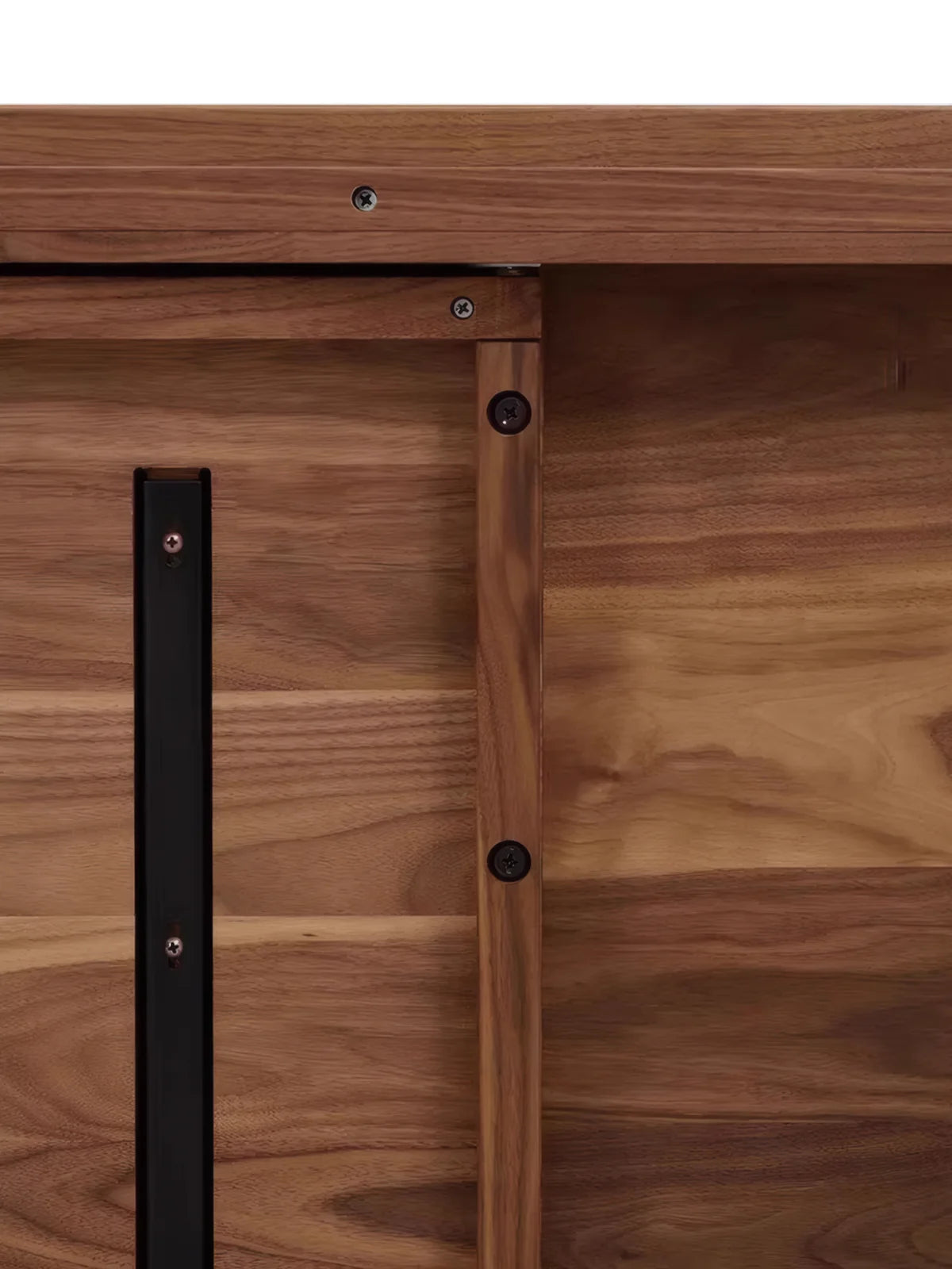 Underside detail of the solid walnut dining table showing support structure and hardware