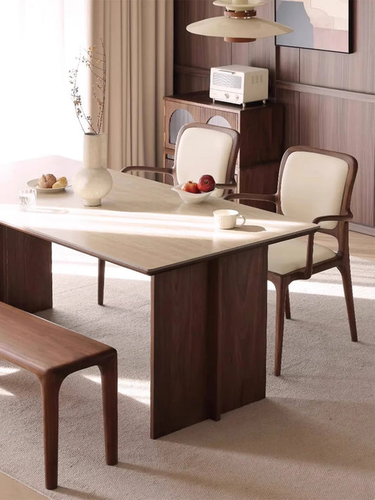 Close-up of the Cael arm chair integrated walnut armrest showing wood grain and smooth finish.
