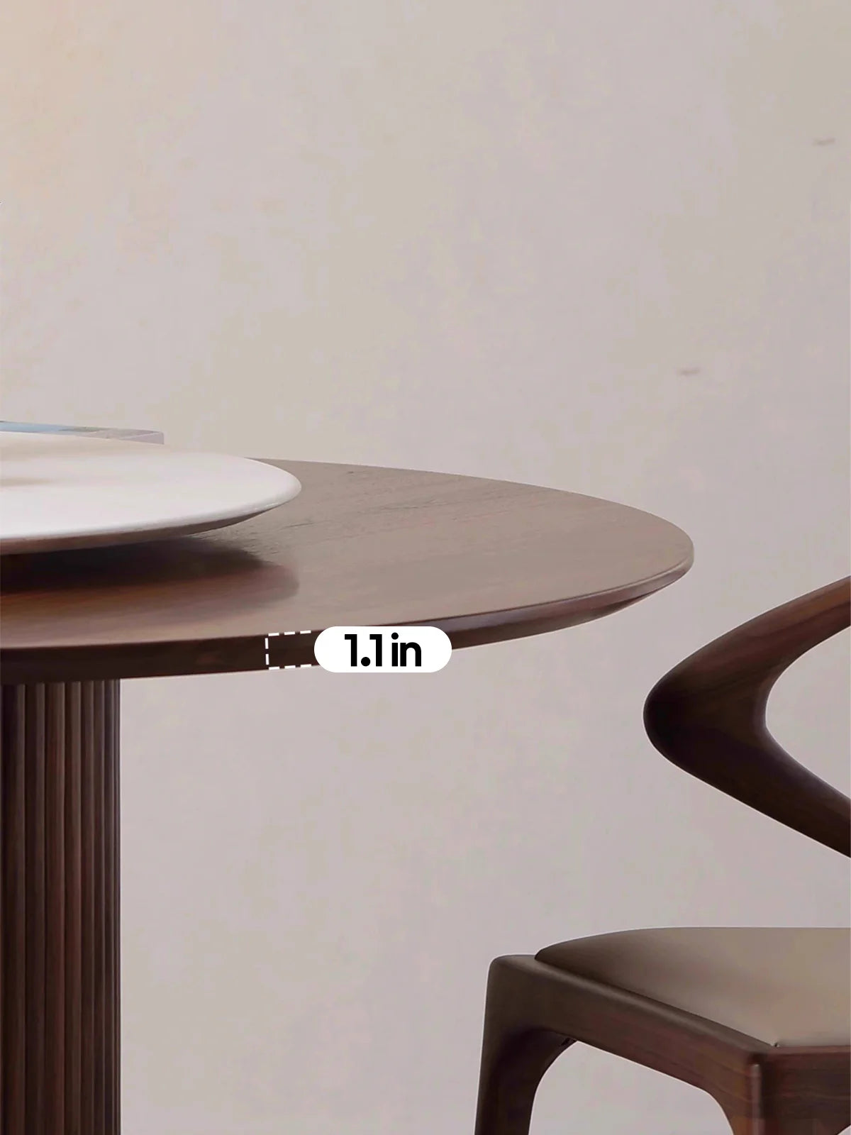 Close-up of the walnut tabletop edge showing the slim profile and softened bevel detail.